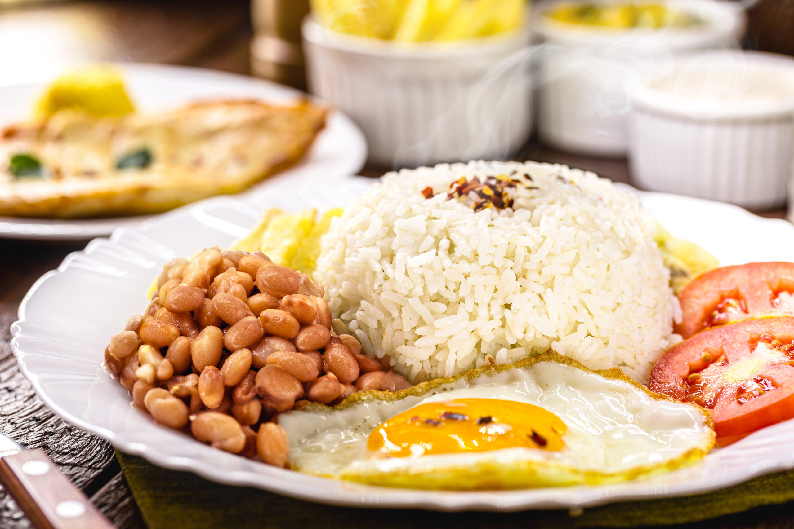 In Brazil, a traditional meal consists of rice and beans, served with a fried egg and salad.